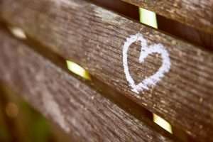 a heart drawn on a wood plank